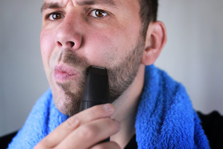 portrait of a man with a beard who needs a shave and a trim beard