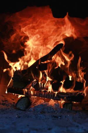 bright flame of burning fire in the oven before cookingの写真素材