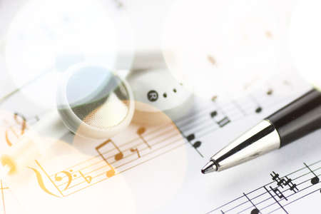 white sheet of paper with musical notes printed with Christmas motifsの写真素材