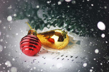 white sheet of paper with musical notes printed with Christmas motifsの写真素材