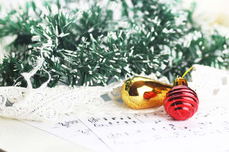 white sheet of paper with musical notes printed with Christmas motifsの写真素材