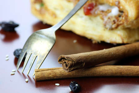 fresh flavorful baked puff pastry with a delicate sweet fondant and raisinの写真素材