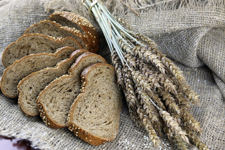 a bouquet of dried rye ears of which makes the bread on the backgroundの写真素材