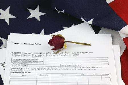 bouquet of dried roses on the American striped flag of the concept of memory and honorsの写真素材