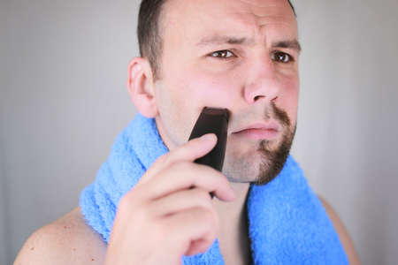 portrait of a man with a beard who needs a shave and a trim beardの写真素材