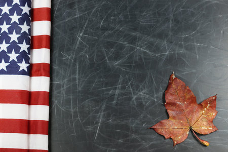 black shabby background chalk board with old inscriptions and traces of the American flagの写真素材
