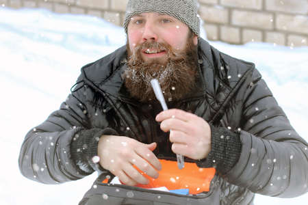 young student in a winter landscape on a sunny nice dayの写真素材