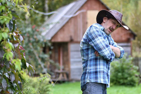 textured very old man with a straight face in the form of a player from the ranchの写真素材