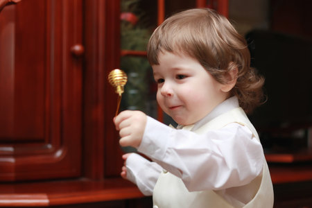 cute little kids on the floor in the interior of a child's room in the new year eveの写真素材