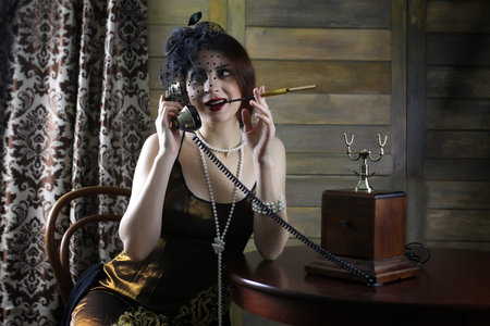 young beautiful girl in a dress style of the early thirties Chicago with a mouthpiece