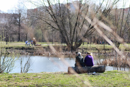 handsome and attractive person in the summer in the landscape of city streets and parksの写真素材