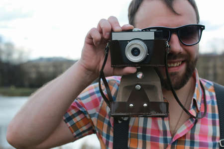 handsome and attractive person in the summer in the landscape of city streets and parksの写真素材