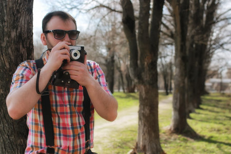 handsome and attractive person in the summer in the landscape of city streets and parks