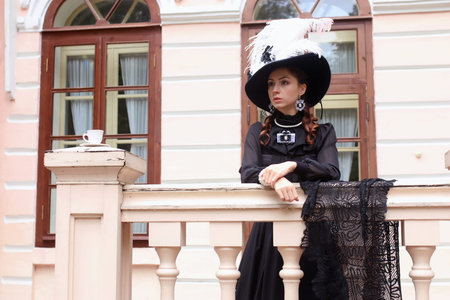 Pretty attractive girl in vintage clothes for a walk in the big merchant's Placeの写真素材