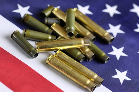 many shell casings from bullets of different caliber in the background chaos concept in the world
