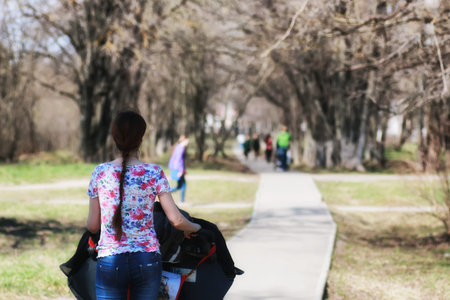 handsome and attractive person in the summer in the landscape of city streets and parksの写真素材