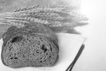 a bouquet of dried rye ears of which makes the bread on the backgroundの写真素材