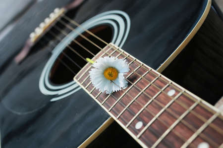 guitar acoustic black glossy six-string playing in natureの写真素材