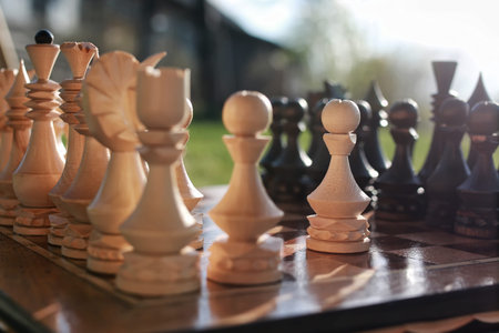 chess pieces arranged on the board mid-game in the fresh air