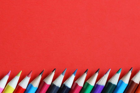 background for education concept scattered pencils and other stationery