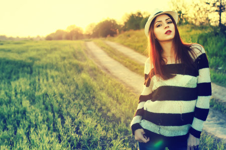 handsome and attractive person in summer strolls through the city streetsの写真素材