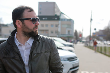handsome and attractive person in the summer in the landscape of city streets and parksの写真素材
