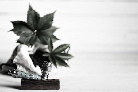 a bag of chopped dry mixture and pipe for marijuana use untreatedの写真素材
