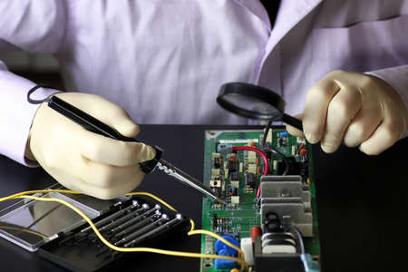 technology engineer of the modern world in a workflow with electronic devicesの写真素材