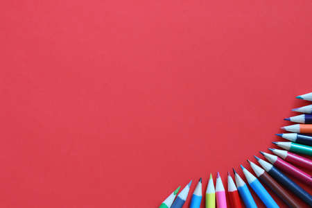 background for education concept scattered pencils and other stationeryの写真素材