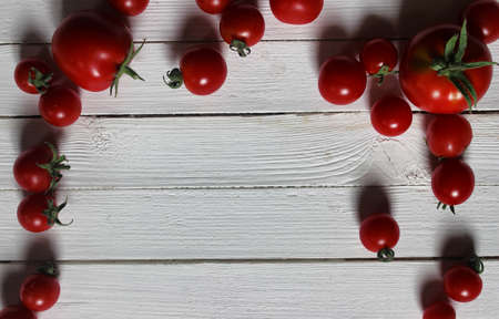 fragrant fresh red cherry tomatoes on background wooden tableの写真素材