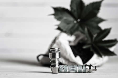 marijuana pipe on wooden backgroundの写真素材