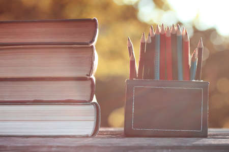 autumn book stack wooden outdoorの写真素材