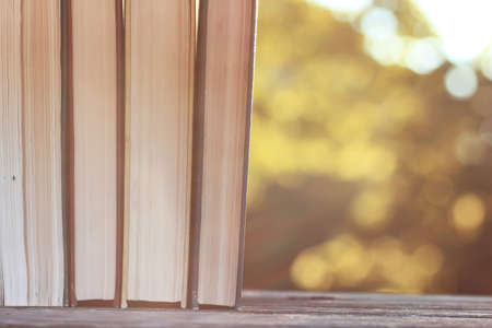 autumn book stack wooden outdoorの写真素材