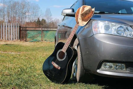 guitar acoustic black glossy six-string playing in natureの写真素材