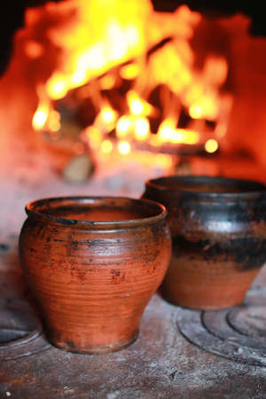 the texture of fire and flame tongues of fire in the furnace of a vintage red brickの写真素材