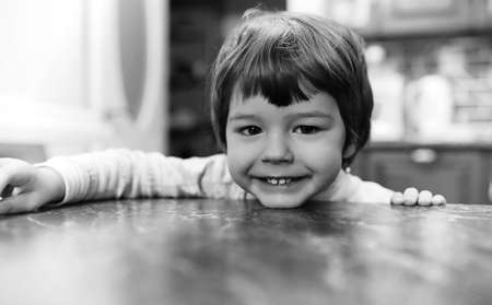 black and white photo of  kid smiling and have fun white backgroの写真素材