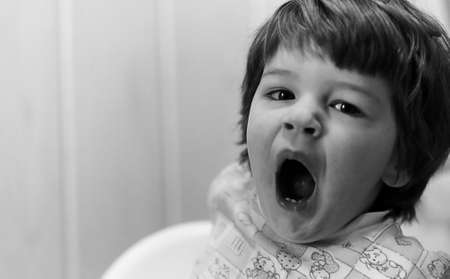 black and white photo of  kid smiling and have fun white backgroの写真素材