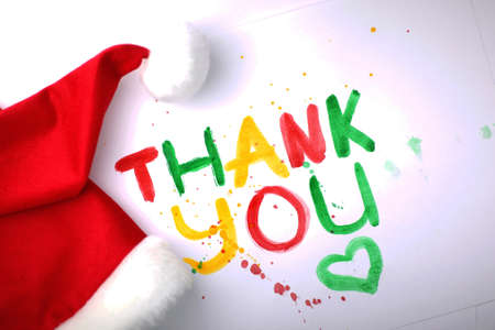 inscription on a white sheet of paper with watercolors Thank youの写真素材