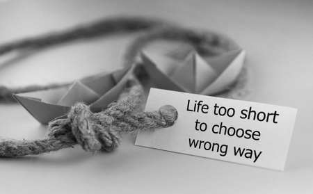 white sticker with thick braided rope and ship paper origamiの写真素材