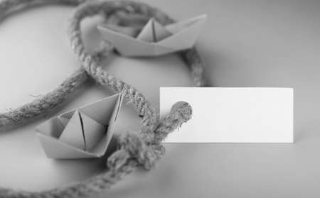 white sticker with thick braided rope and ship paper origamiの写真素材