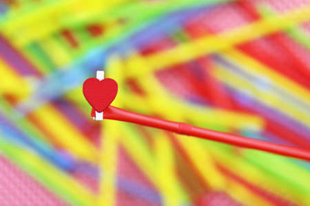 colorful cocktail tubes lie on a bright color backgroundの写真素材