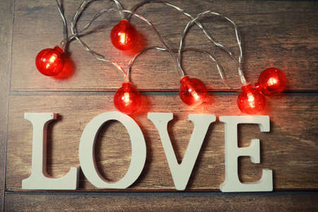 word Love from wooden letters on a wood backgroundの写真素材
