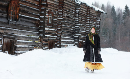 young girls in traditional costumes of the Russian north in wintの写真素材