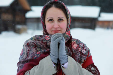 young girls in traditional costumes of the Russian north in wintの写真素材
