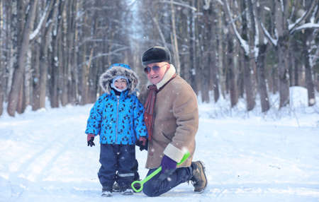 family walks on Winter Park during the weekendの写真素材