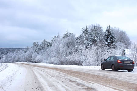 landscape Road in the winter forest with snow coveredの写真素材