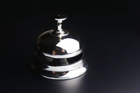 bell and the key at the reception in the hotelの写真素材
