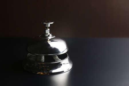 bell and the key at the reception in the hotelの写真素材