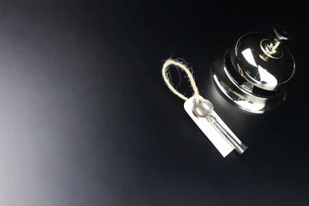 bell and the key at the reception in the hotelの写真素材