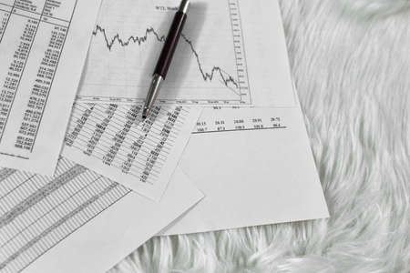 pen on paper with the price quotes and chartsの写真素材